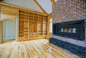 Hearth room featuring brick fireplace surround