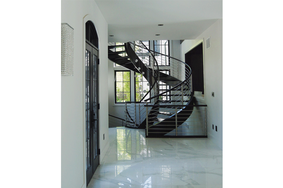 Custom spiral staircase with white marble floors