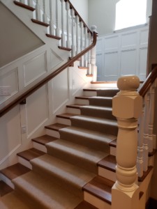 Grand staircase in custom home design