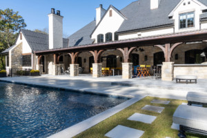 Large outdoor area featuring a pool oasis