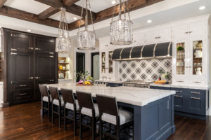 Custom gourmet kitchen featuring a French country design