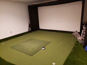 Custom golf simulator with screen
