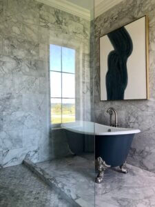 Master bathroom featuring natural stone surfaces